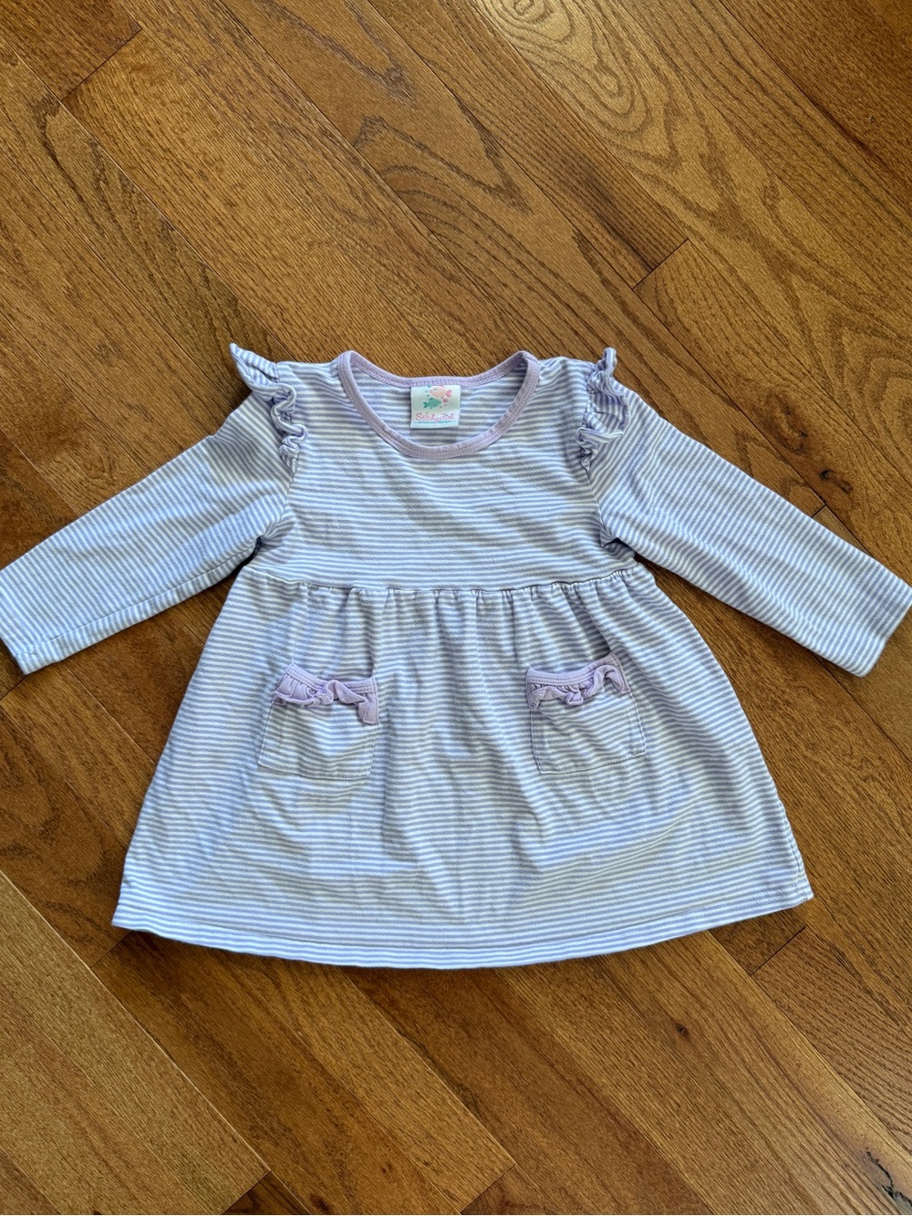 Stitchy Fish purple striped girls top